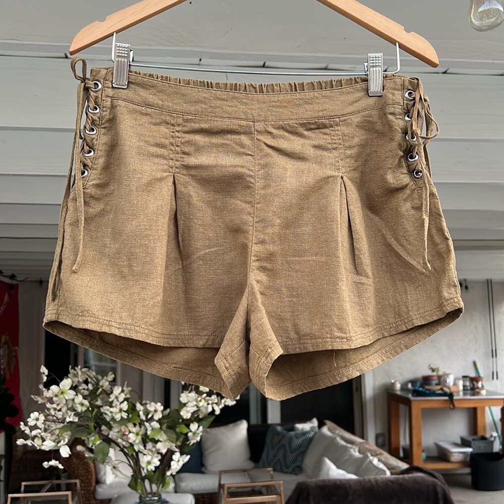 Free People pleated olive linen shorts with cute side braided grommet detailing